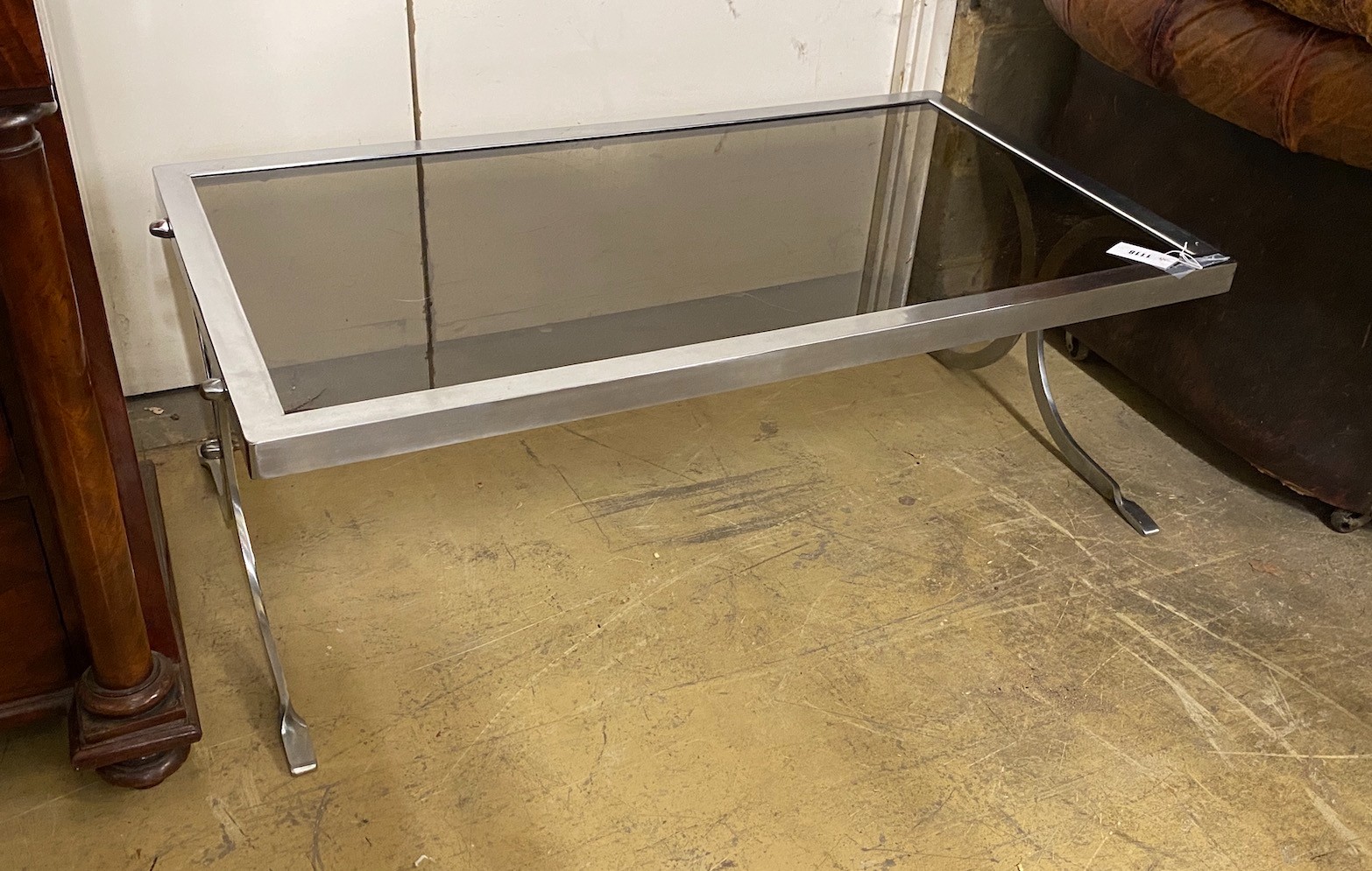 A smoked glass top mid century coffee table, length 107cm, height 61cm